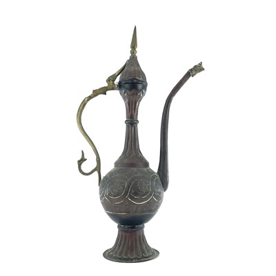 Lot 1022 - An Islamic copper ewer, 19th century, height...