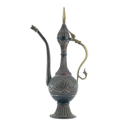 Lot 1022 - An Islamic copper ewer, 19th century, height...