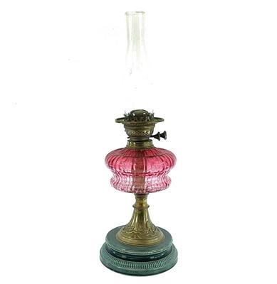 Lot 261 - A Victorian oil lamp, with a cranberry glass...