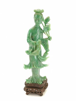 Lot 170 - A Chinese carved jade figure of guanyin, 19th century.