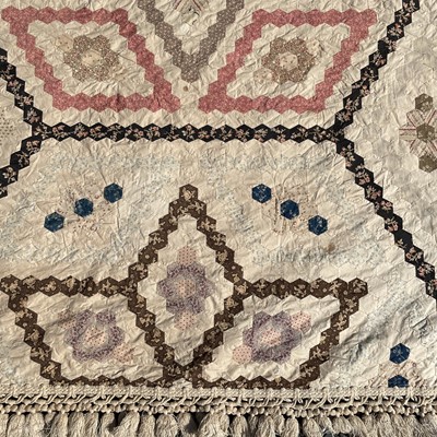 Lot 1609 - A Victorian patchwork quilt with hexagonal...