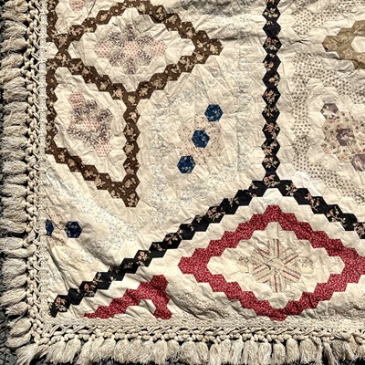 Lot 1609 - A Victorian patchwork quilt with hexagonal...