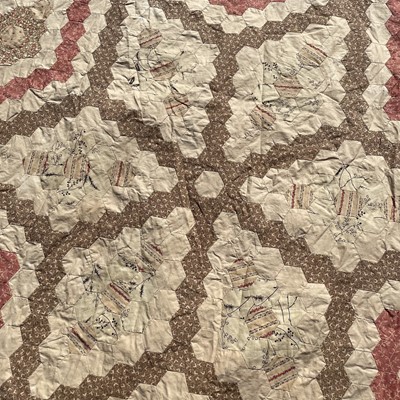 Lot 1609 - A Victorian patchwork quilt with hexagonal...