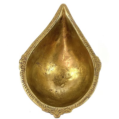 Lot 1038 - An Indian gilt metal oil lamp, height 4.5cm,...