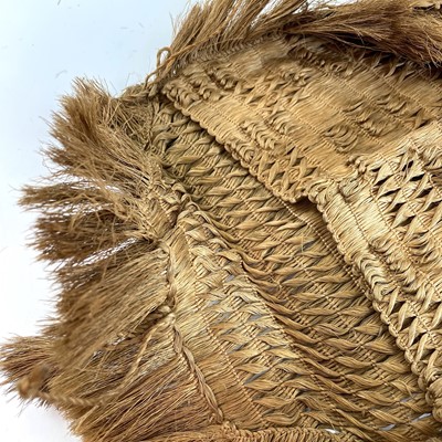Lot 34 - A Maori flax bag woven with a fringed edge,...