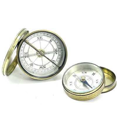 Lot 208 - An early 20th brass compass with a printed...