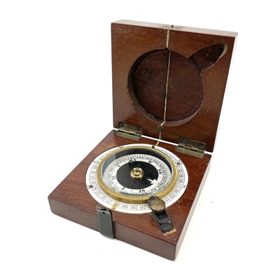 Lot 24 - A WWI maritime hand held compass in a mahogany...