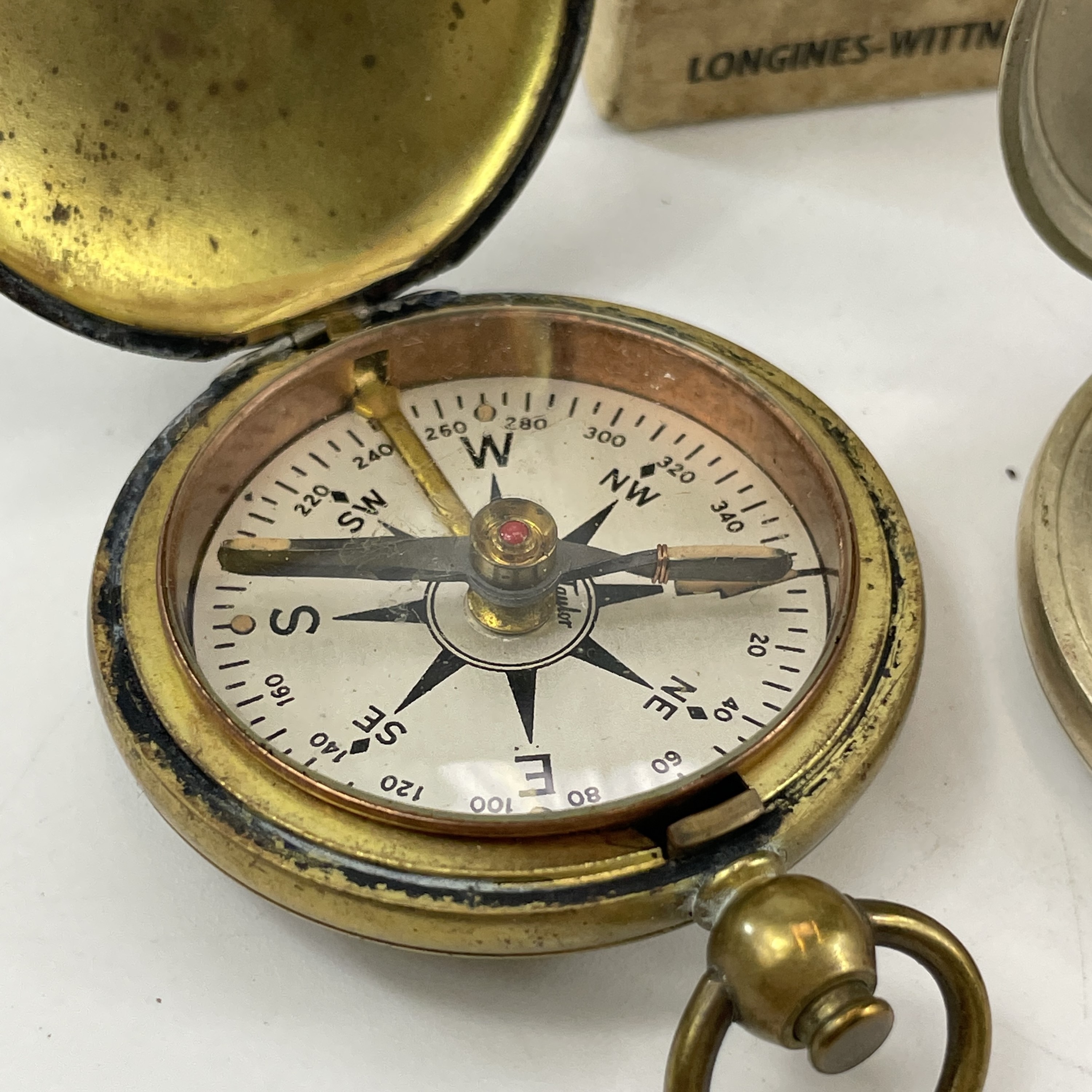 Lot 217 A WWII Longines Wittnauer compass with