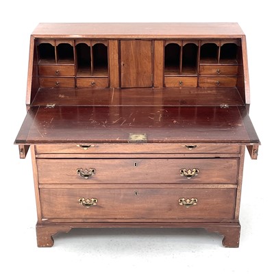 Lot 1811 - A 19th century mahogany bureau, the fall front...