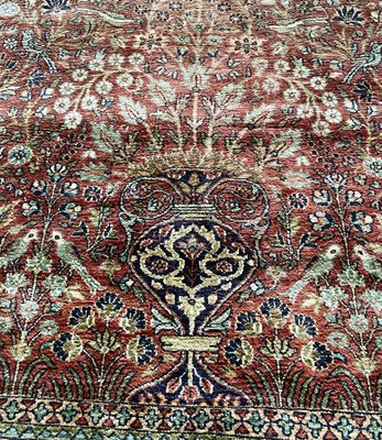 Lot 1202 - An Indian silk rug.