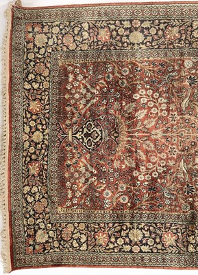 Lot 1202 - An Indian silk rug.