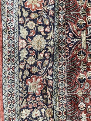 Lot 1202 - An Indian silk rug.