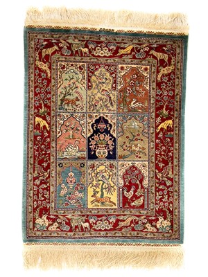 Lot 1201 - A Hereke silk rug.