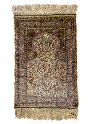 Lot 1203 - An exceptionally fine Hereke silk rug.