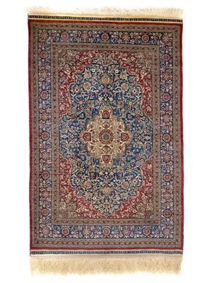 Lot 1204 - A Hereke silk rug.