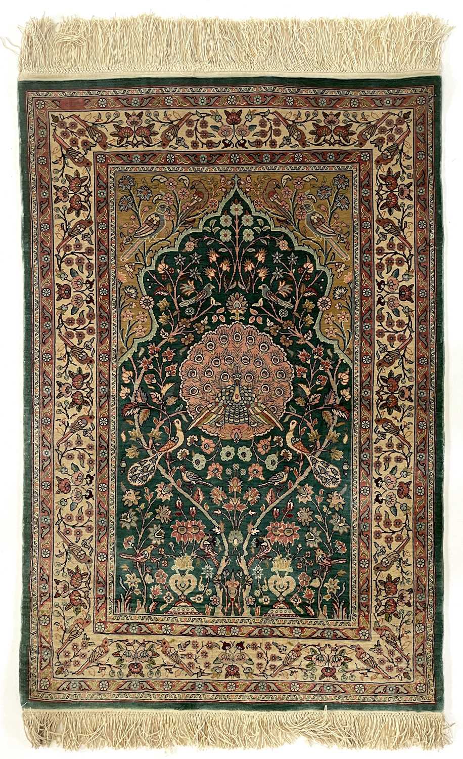 Lot 1207 - A Hereke silk rug.