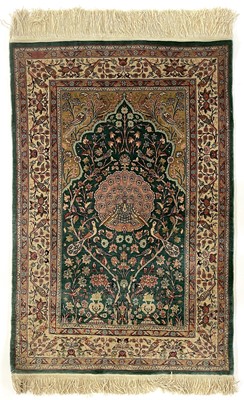 Lot 1207 - A Hereke silk rug.