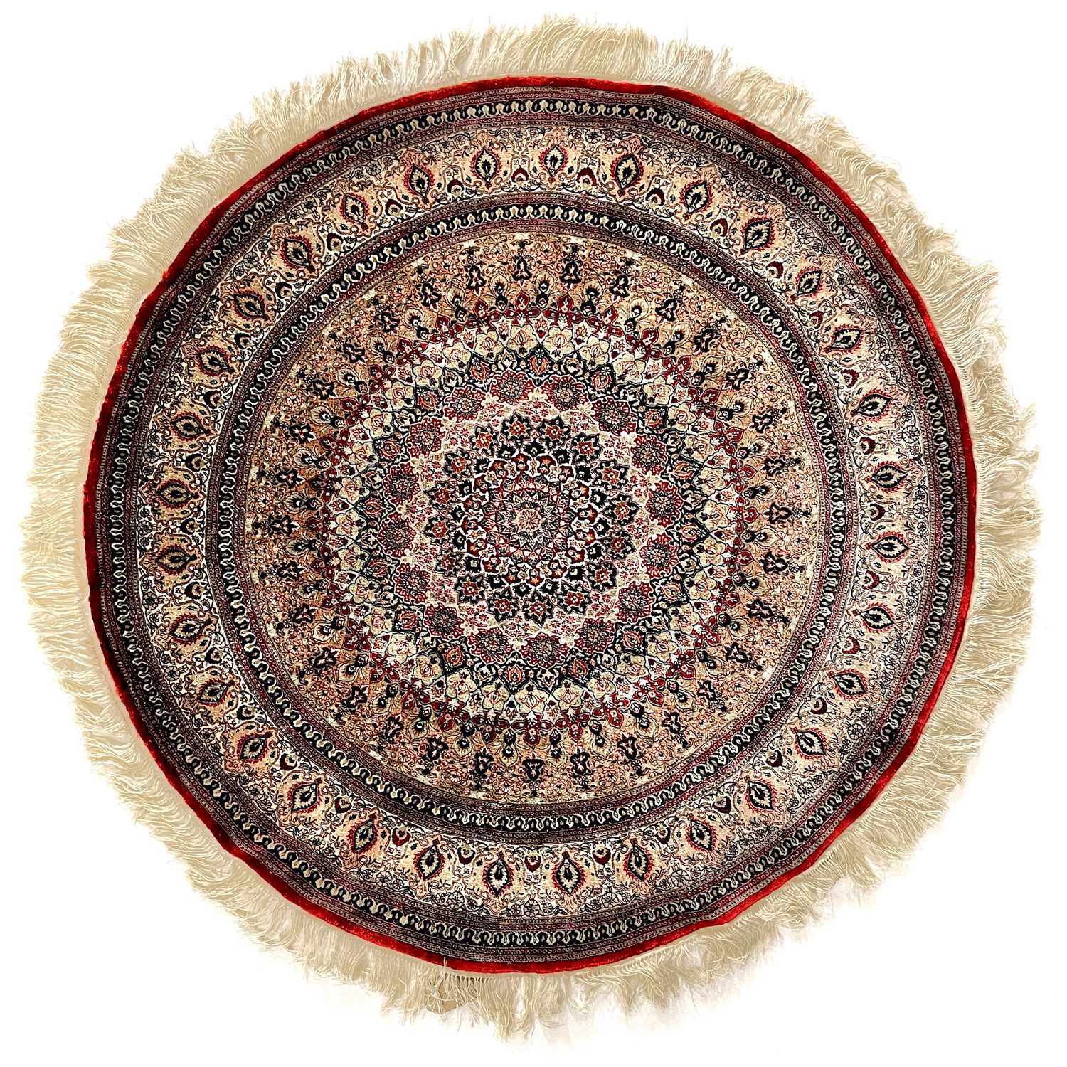 Lot 1206 - A circular silk rug.