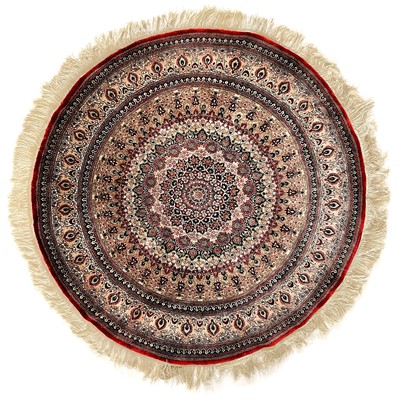 Lot 132 - A circular silk rug.