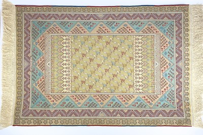 Lot 1208 - An exceptionally fine and rare Hereke silk rug.