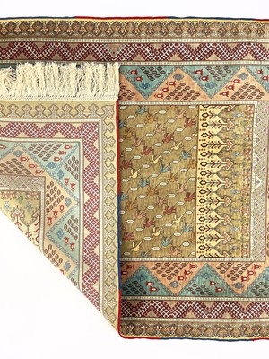 Lot 1208 - An exceptionally fine and rare Hereke silk rug.