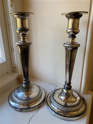 Lot 104 - A pair of Sheffield plated candlesticks.