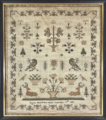 Lot 1613 - An early Victorian silk sampler, worked with...