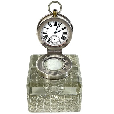 Lot 113 - An unusual silver timepiece lidded glass inkwell.