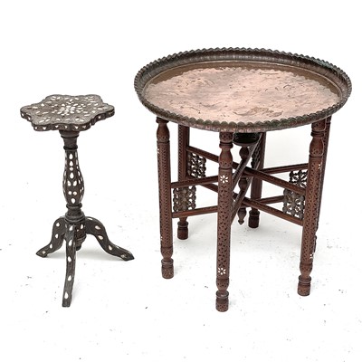 Lot 1892 - A Middle Eastern circular copper top table,...