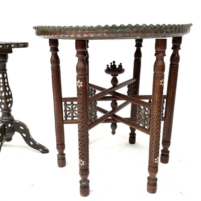 Lot 1892 - A Middle Eastern circular copper top table,...