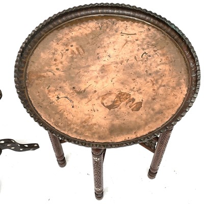 Lot 1892 - A Middle Eastern circular copper top table,...