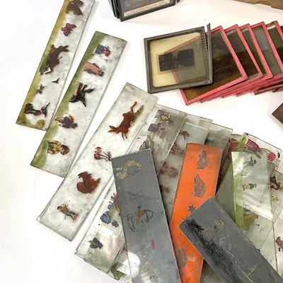 Lot 158 - A collection of eleven painted magic lantern...