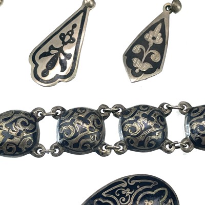 Lot 229 - A Russian silver and niello semi spherical bracelet.