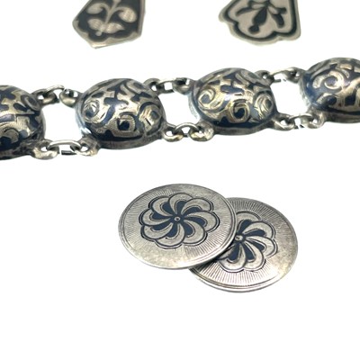 Lot 229 - A Russian silver and niello semi spherical bracelet.