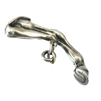 Lot 25 - A silver seal fob and pipe tamper in the form of a horses leg.