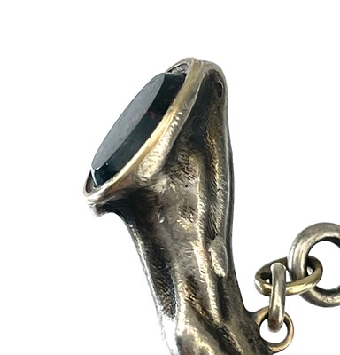 Lot 25 - A silver seal fob and pipe tamper in the form of a horses leg.