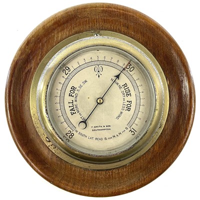 Lot 1714 - A brass marine aneroid barometer, the silvered...