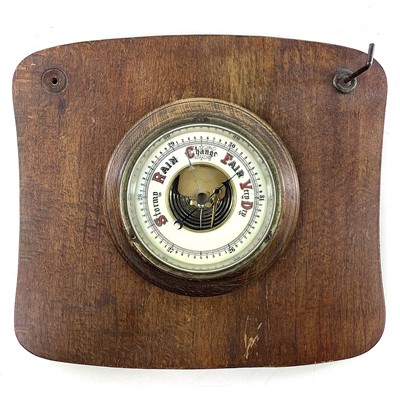 Lot 1714 - A brass marine aneroid barometer, the silvered...