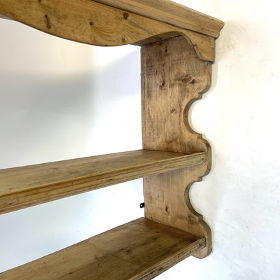 Lot 175 - A set of pine hanging shelves