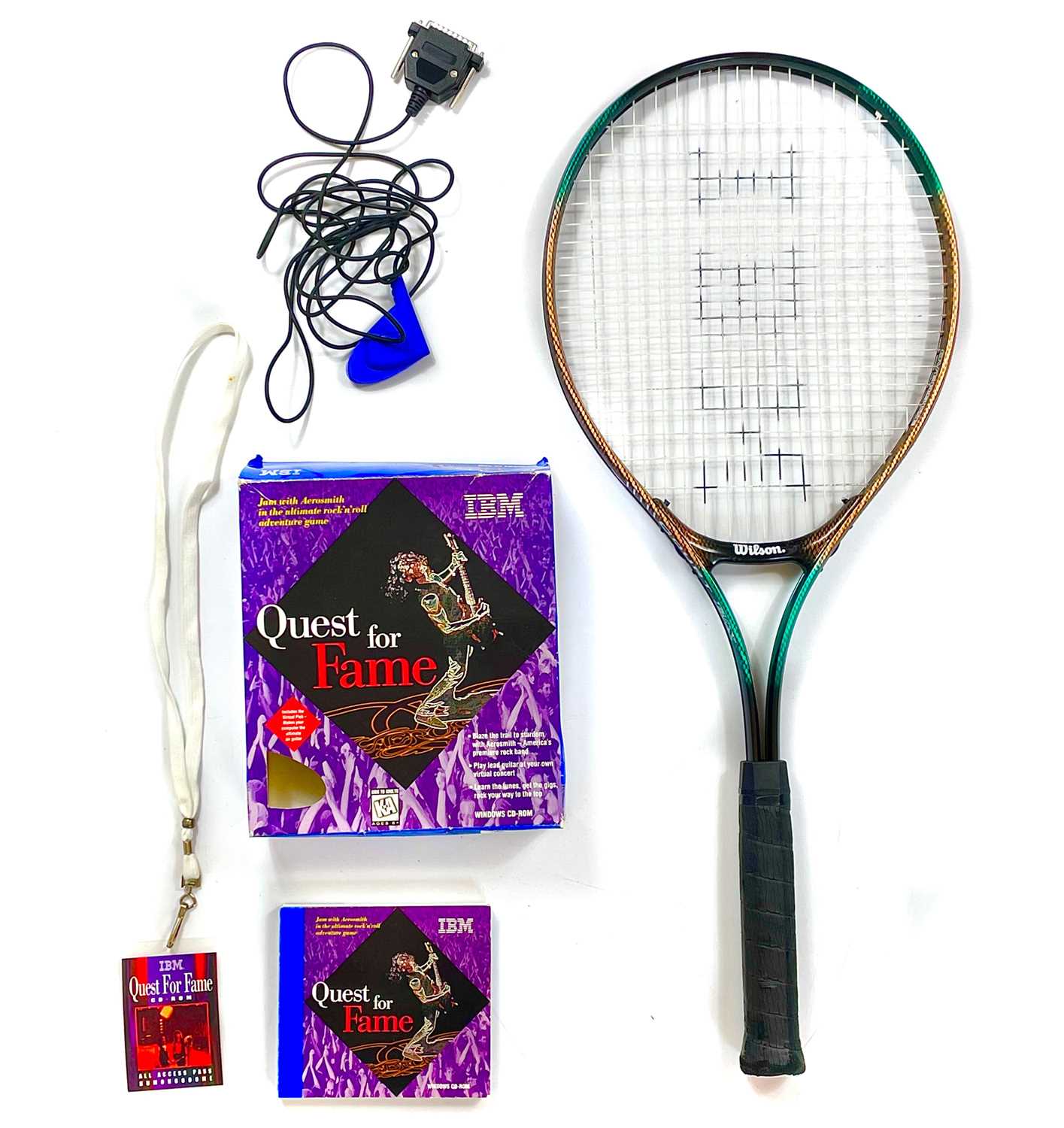 Lot 317 - An Aerosmith Quest For Fame video game and tennis racket.