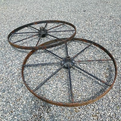 Lot 600 - A pair of large iron implement wheels, 123cm...