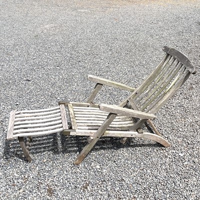 Lot 607 - A teak folding garden steamer armchair with...