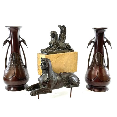 Lot 246 - A bronze sphinx figure length 19cm together...