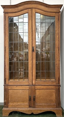 Lot 1918 - An oak bookcase, early 20th century, in the...