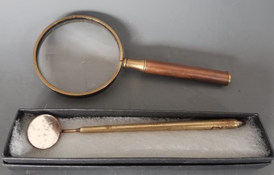 Lot 38 - A trench art dental tool and magnifying glass.