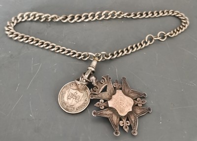 Lot 11 - An antique Albert chain with a silver golfing...