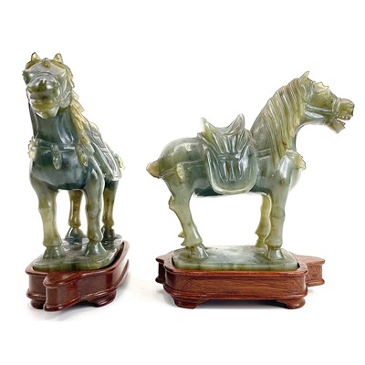 Lot 331 - A pair of Chinese jade carved horses on wood stands.