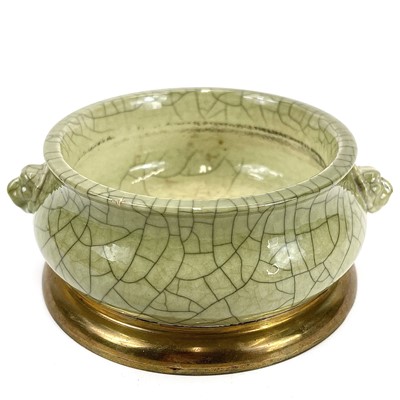 Lot 348 - A Chinese porcelain celadon crackle glaze censer with brass mounted base.