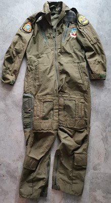 Lot 9 - A pilot's flight suit decorated with patches.