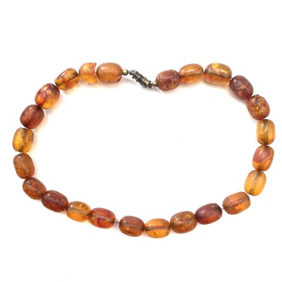 Lot 275 - An amber oval bead necklace.